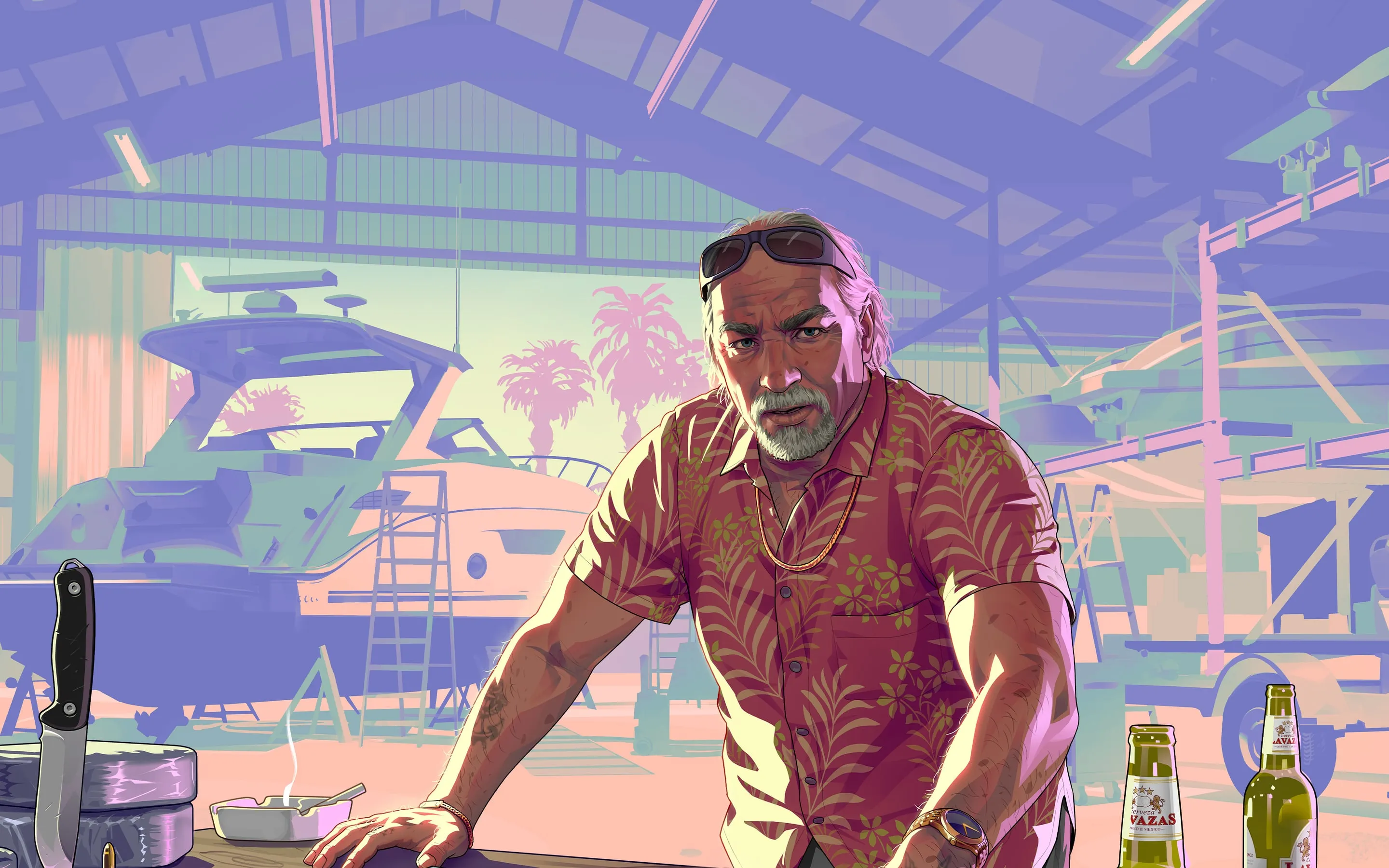 Brian Heder leaning over a map, in a boat shed