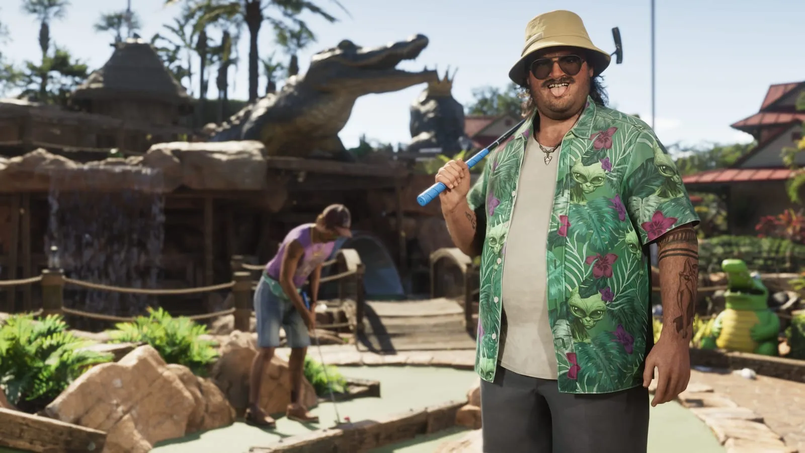 Homme moustachu au minigolf, club sur l'épaule, alligator géant en résine derrière lui