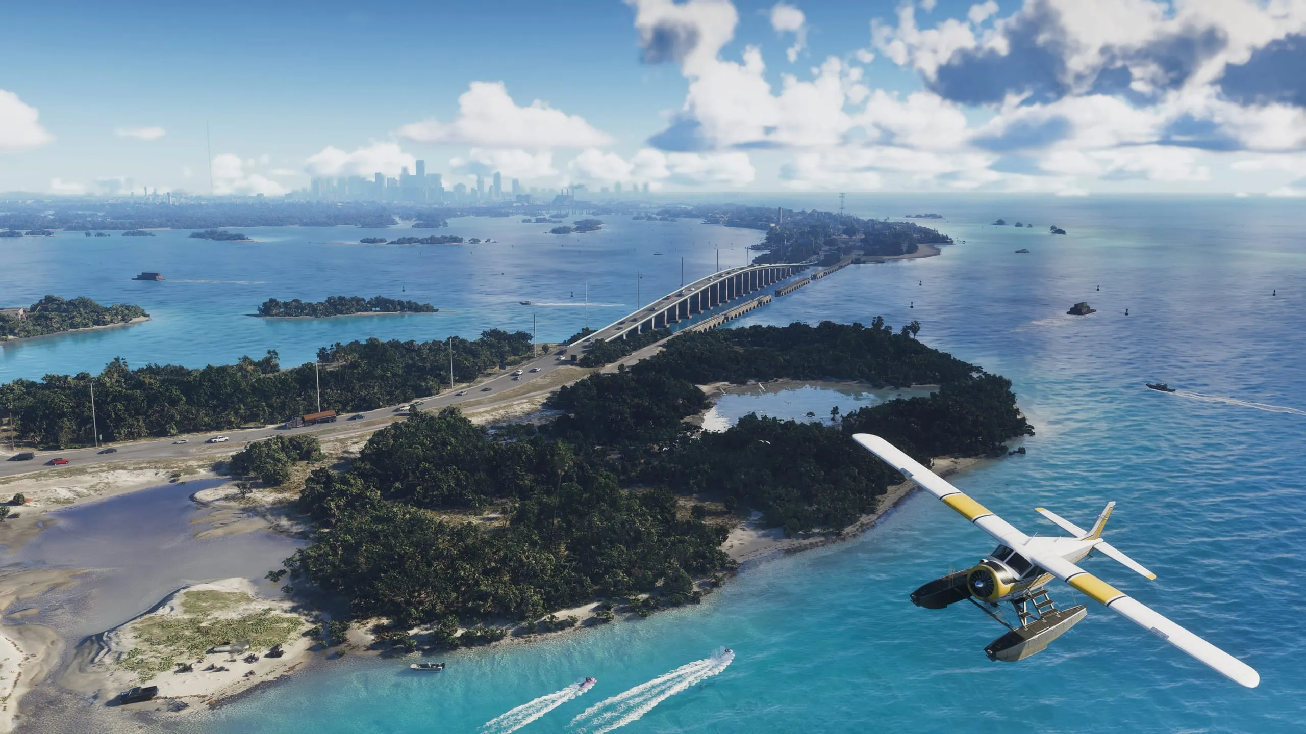 Seaplane over the causeway linking the Leonida Keys, distant city skyline across turquoise water