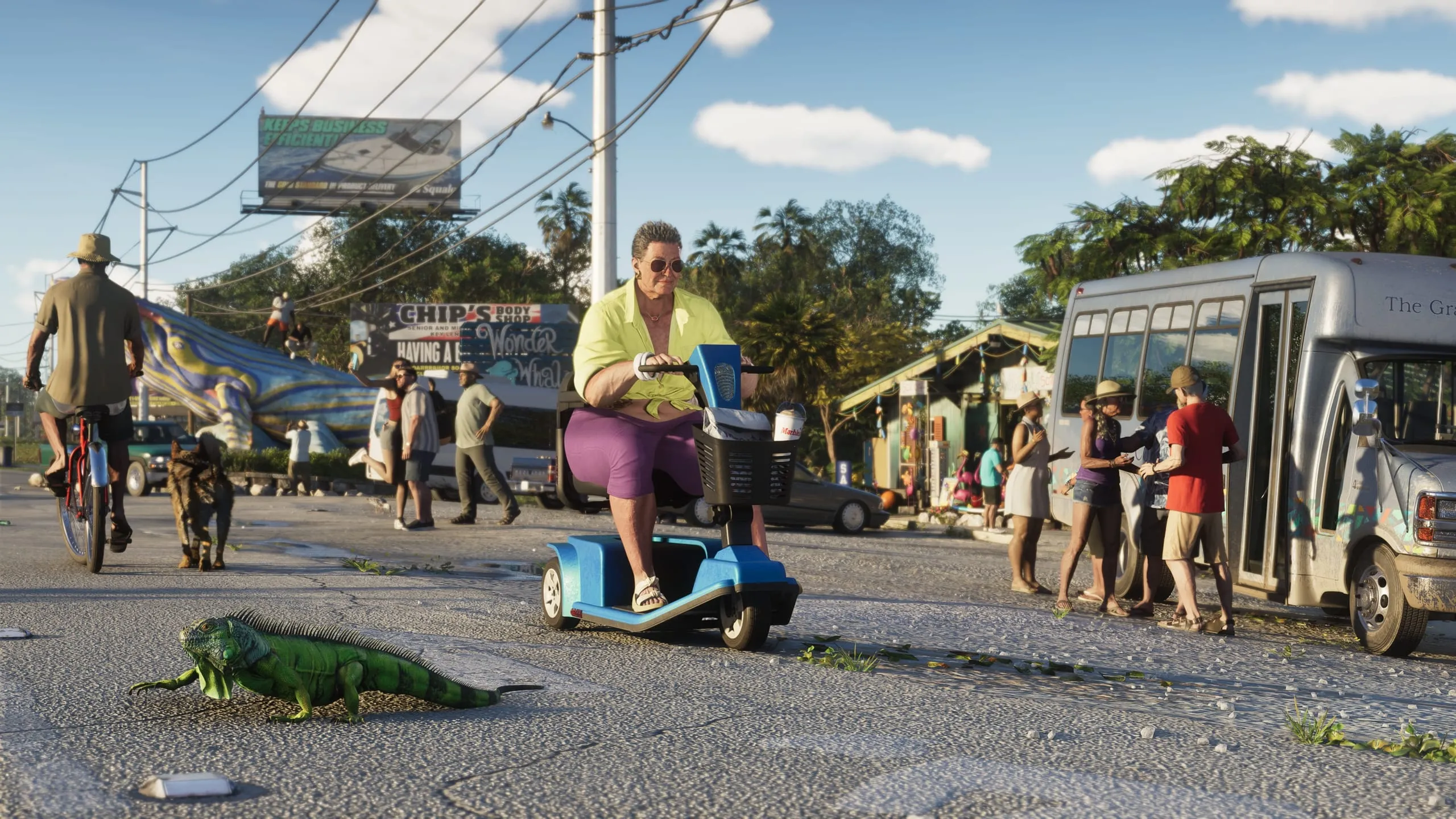 Green iguana crossing a Keys main street as an older woman rides a mobility scooter