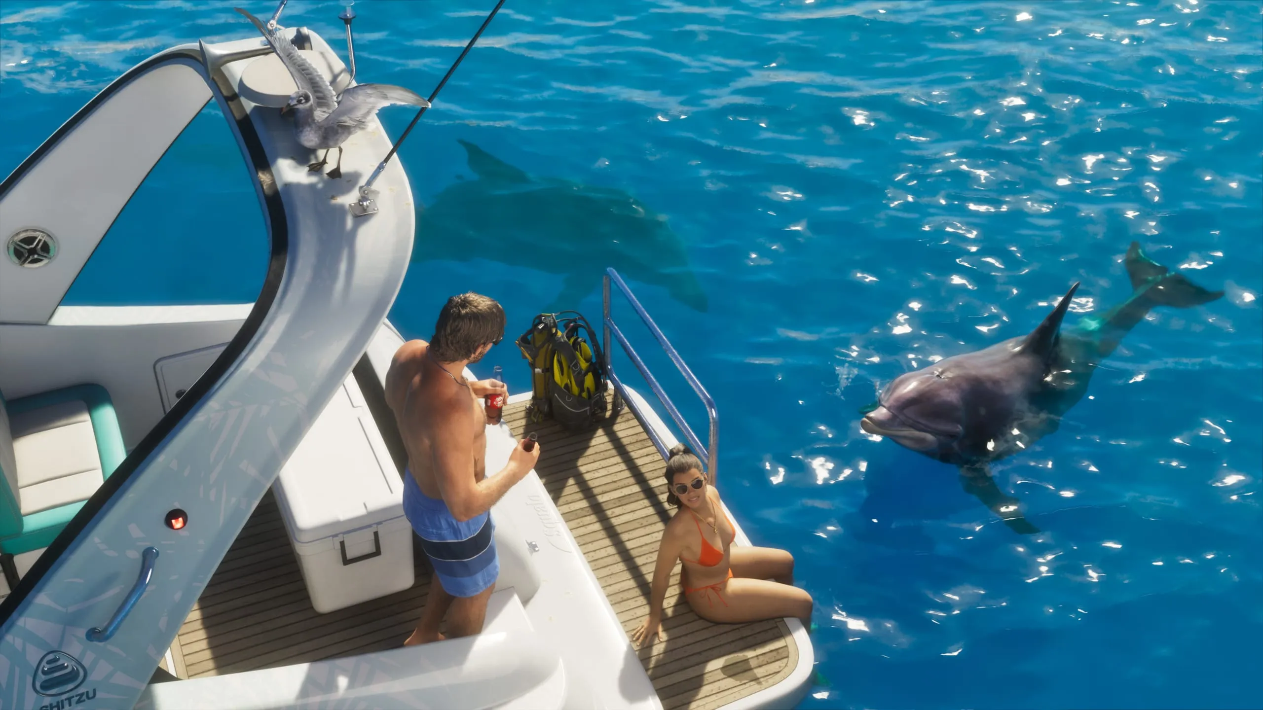 Two swimmers on a boat's swim platform watching a dolphin surface in bright turquoise water