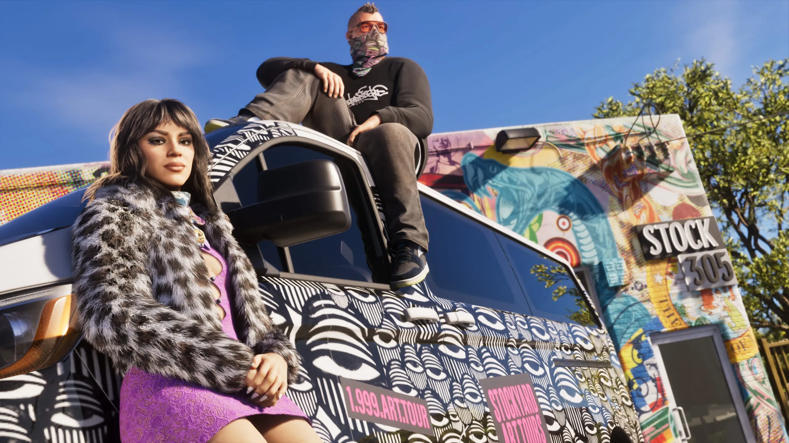 Graffiti wrapped van outside a mural covered storefront, woman in leopard coat and man sitting on the roof